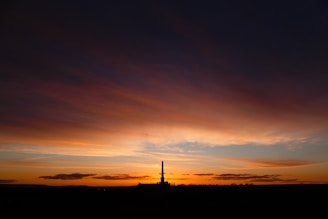 Close-up of a sleek, glowing hydro-rocket on the launchpad ready for takeoff at sunset.