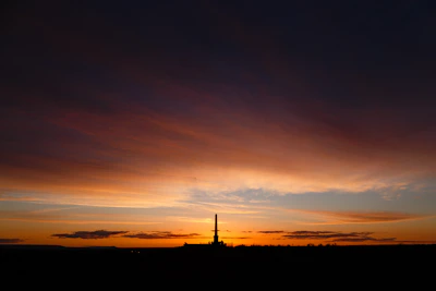 A sleek rocket launch captured at dawn with vibrant colors illuminating the sky.