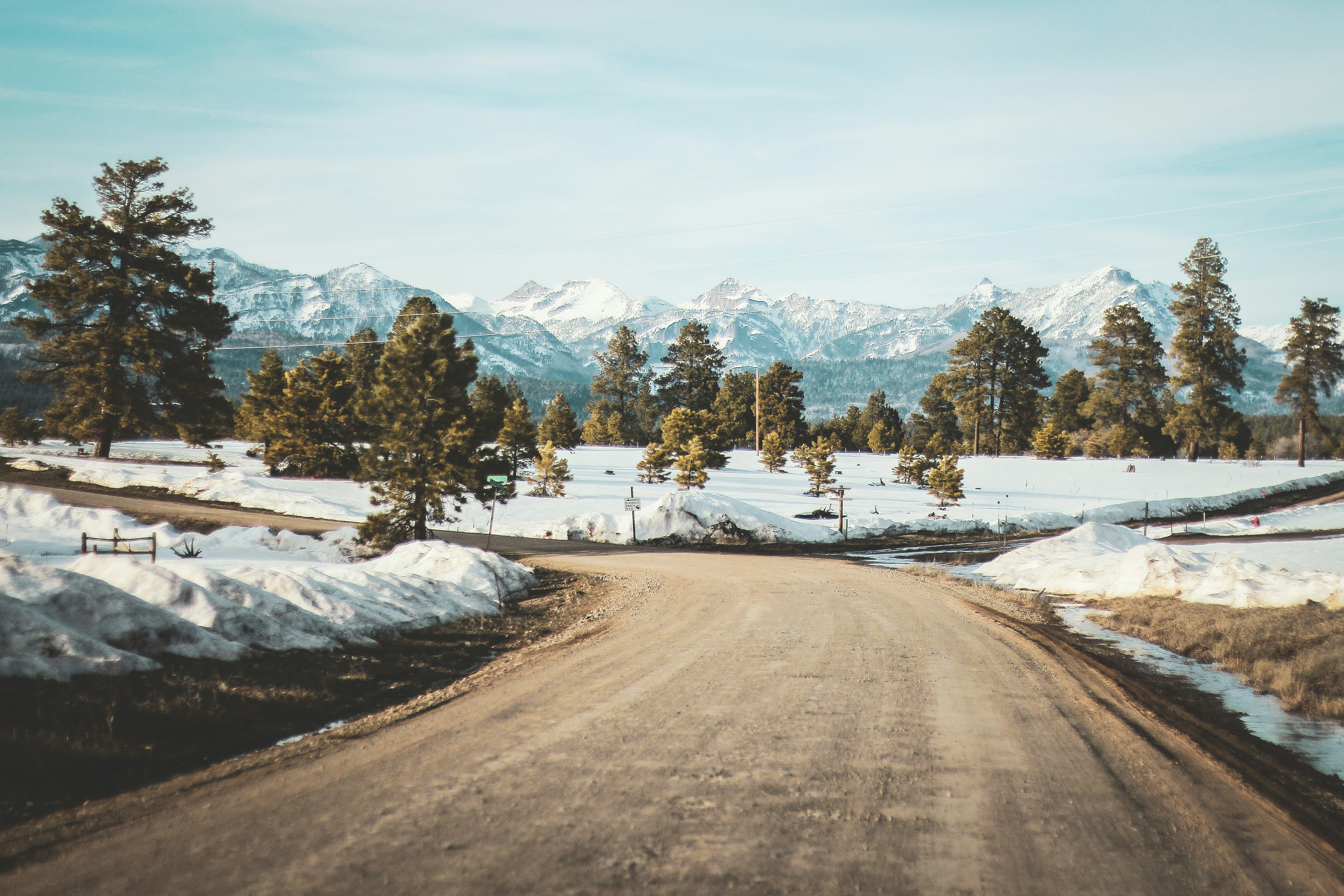 soil road beside snow field, 