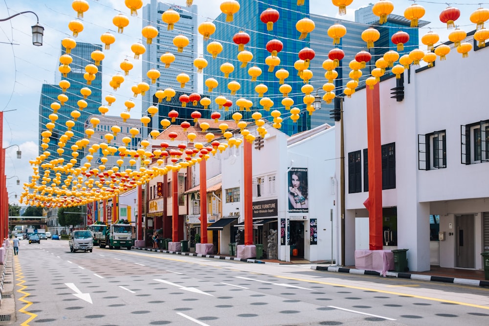 yellow and red paper lanterns on road