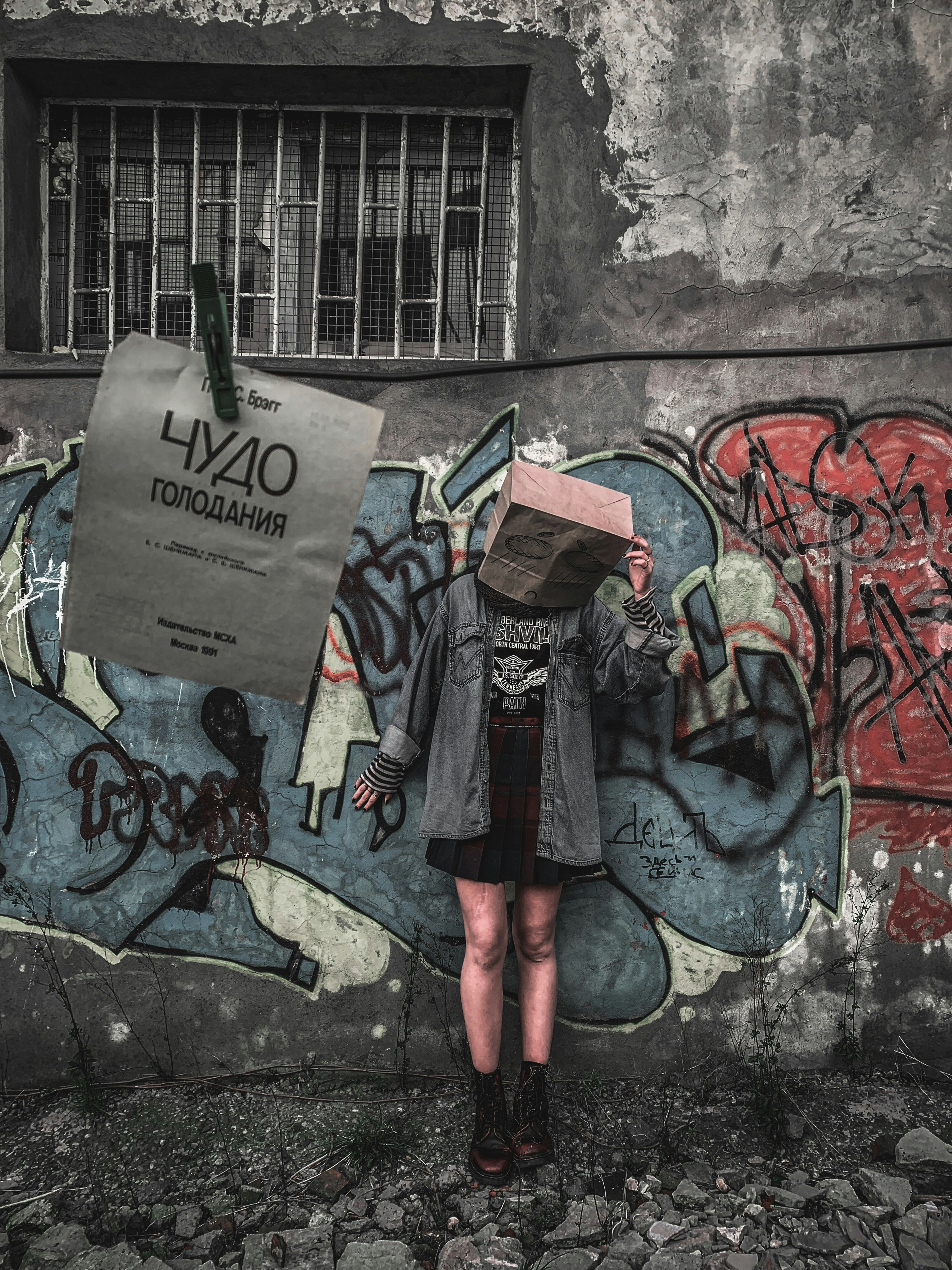 A woman standing in front of a wall covered in graffiti photo – Free ...