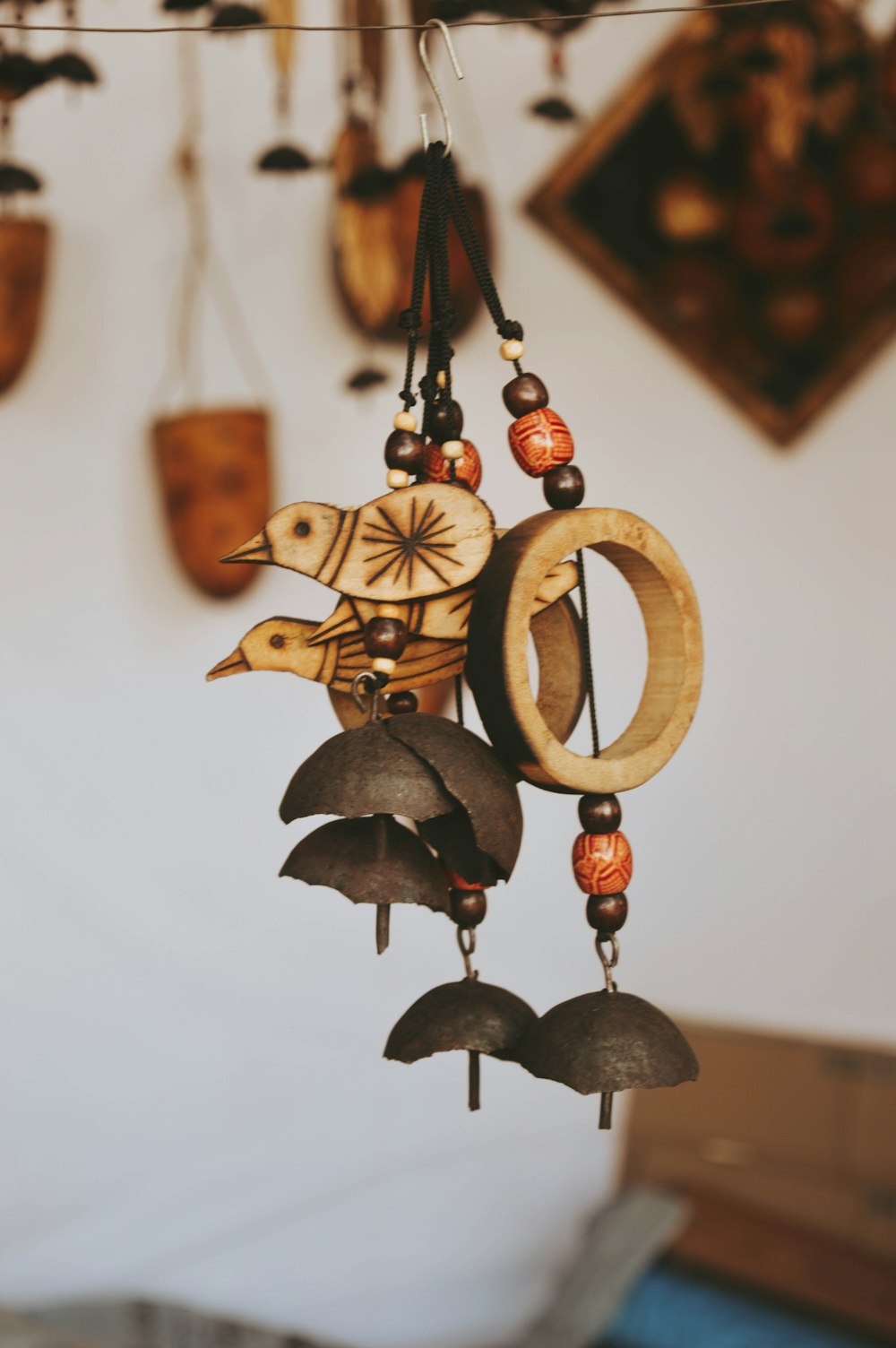 selective focus photo of brown wind chimes