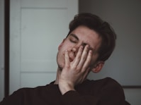 man wearing black crew-neck top