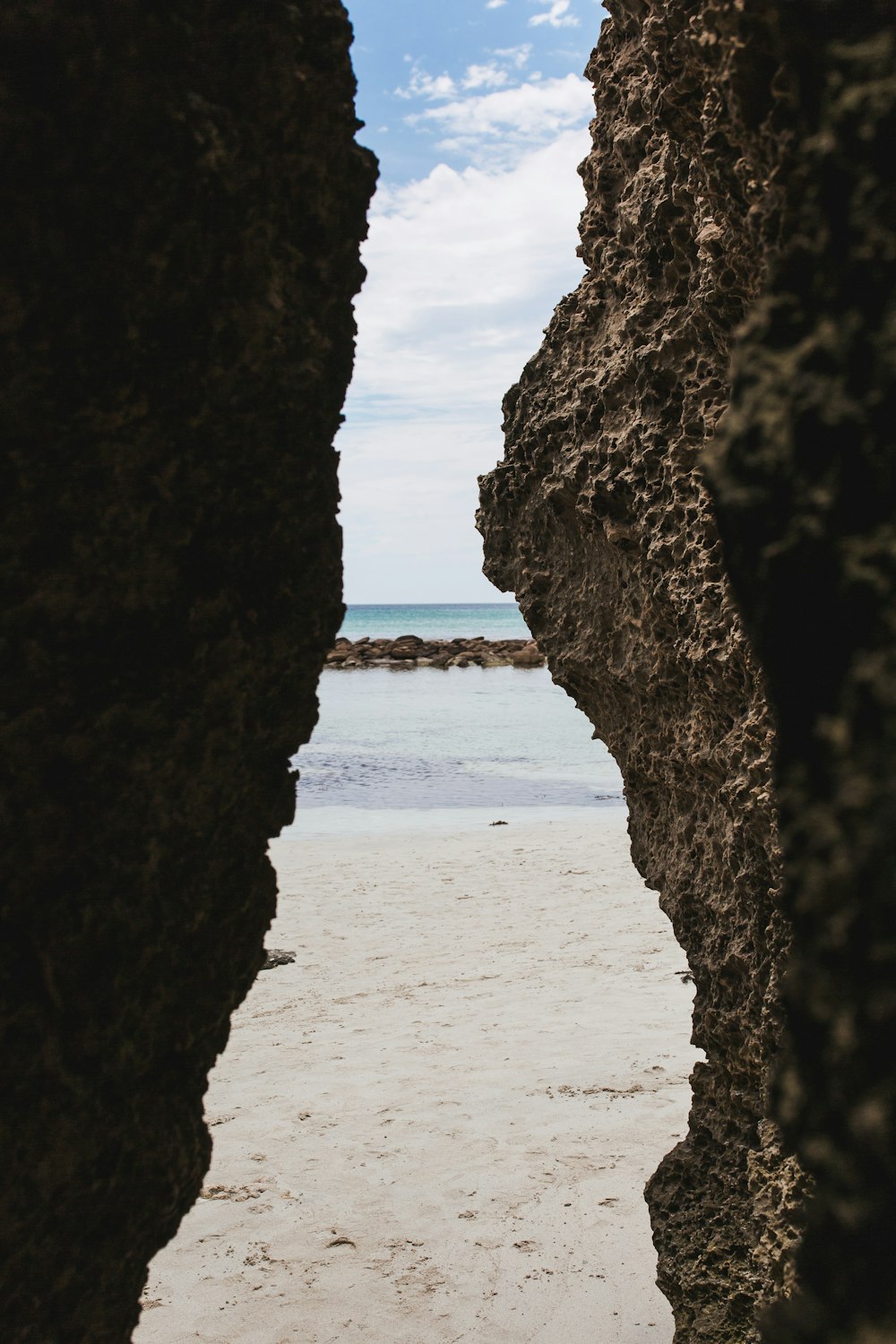 brown rock on seashore during daytime