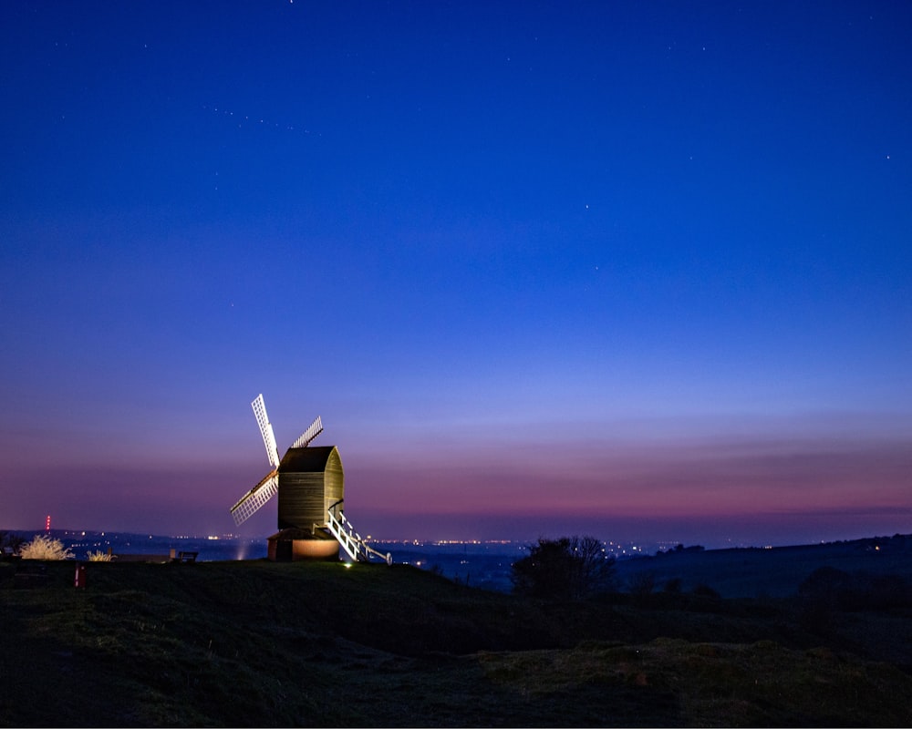 turned-on lights on windmill during night
