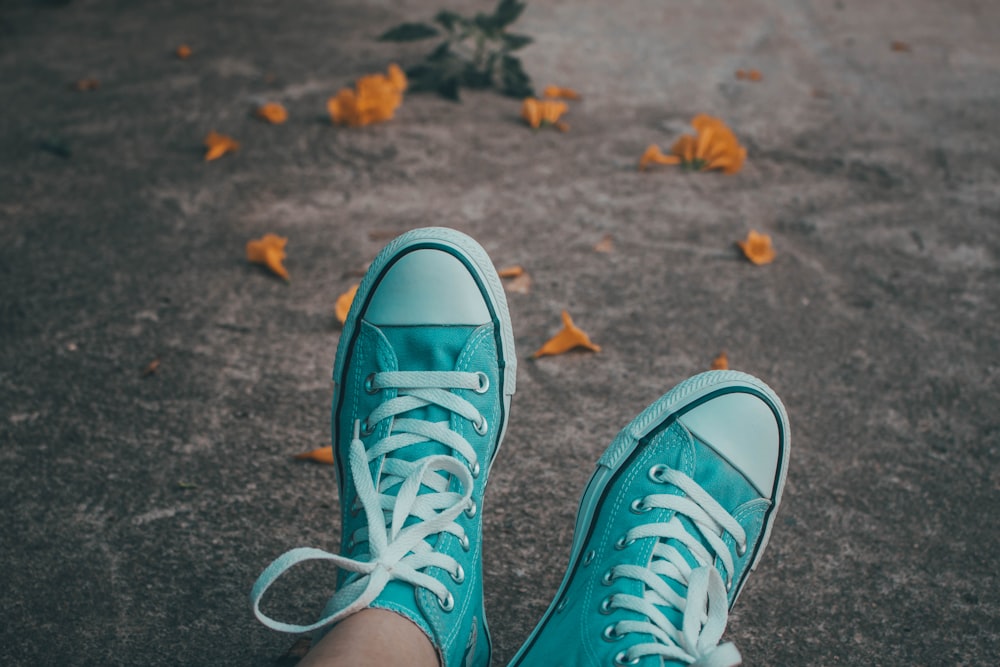 pair of teal high-top sneakers