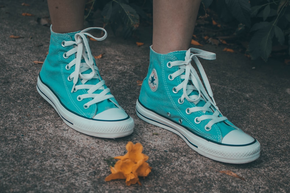 pair of teal Converse All-Star high-tops