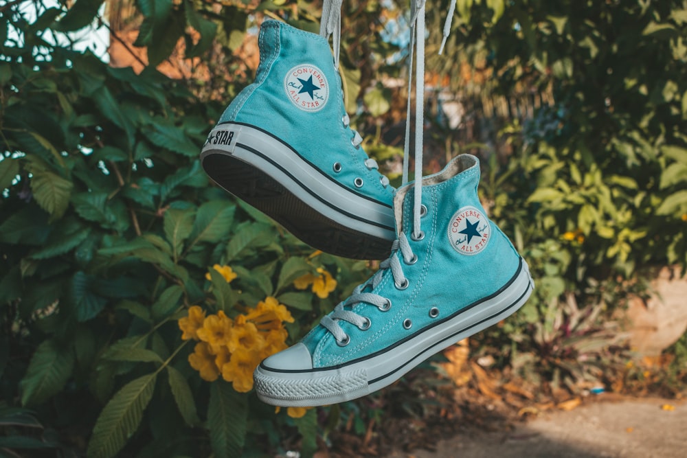 pair of teal Converse hightops hanging photo – Free Shoe Image on Unsplash