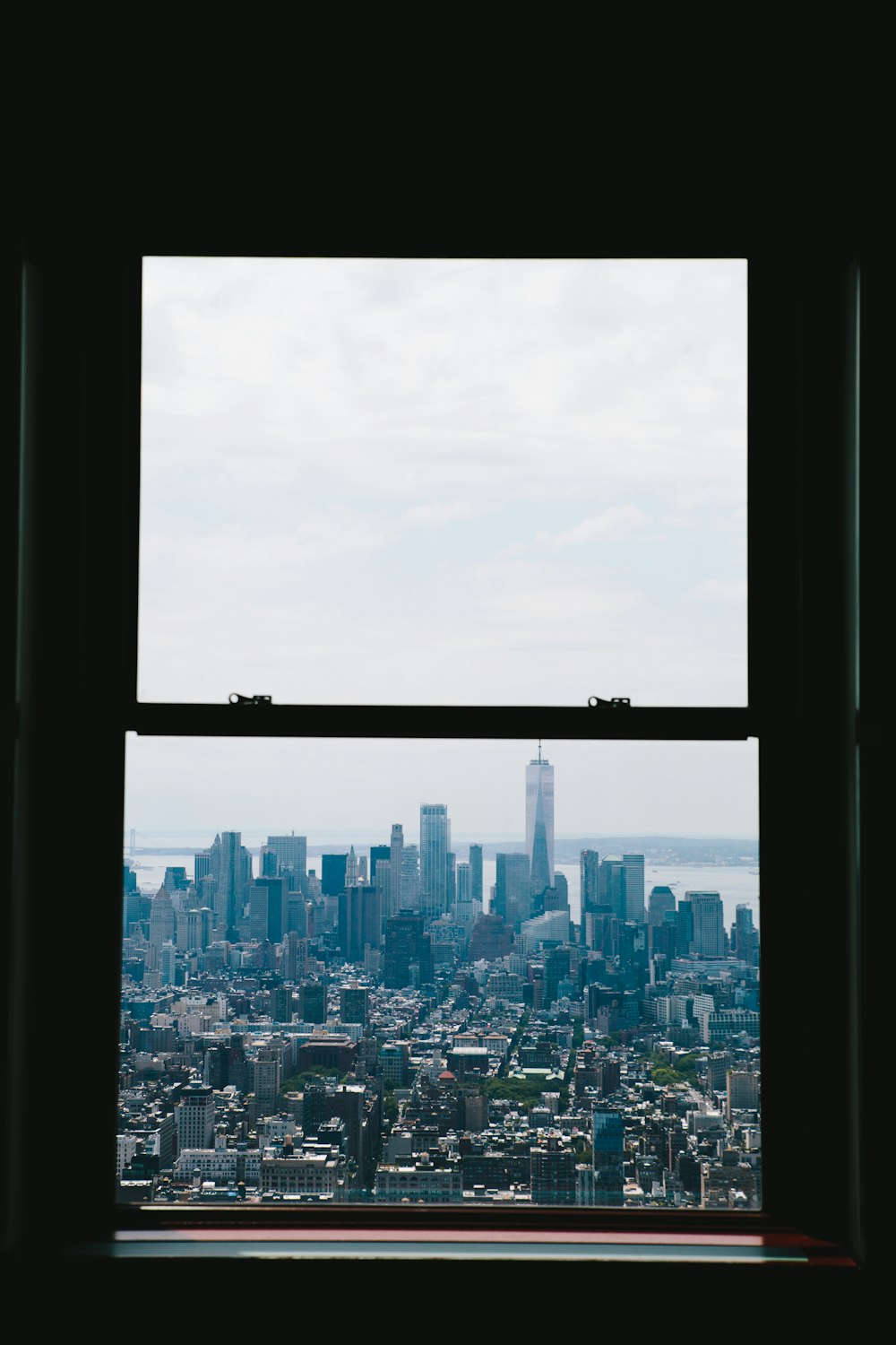 closed window through high rise buildings