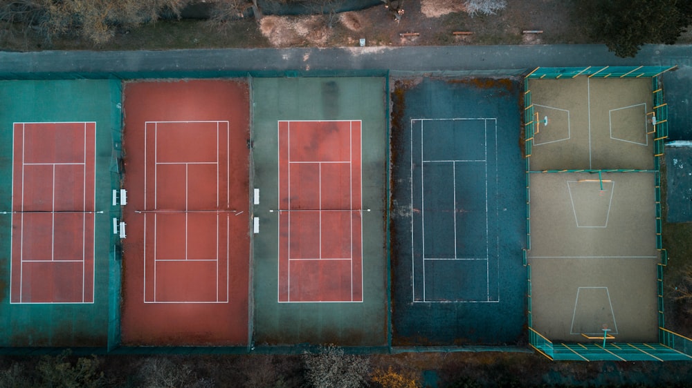 high-angle photography of tennis and basketball courts