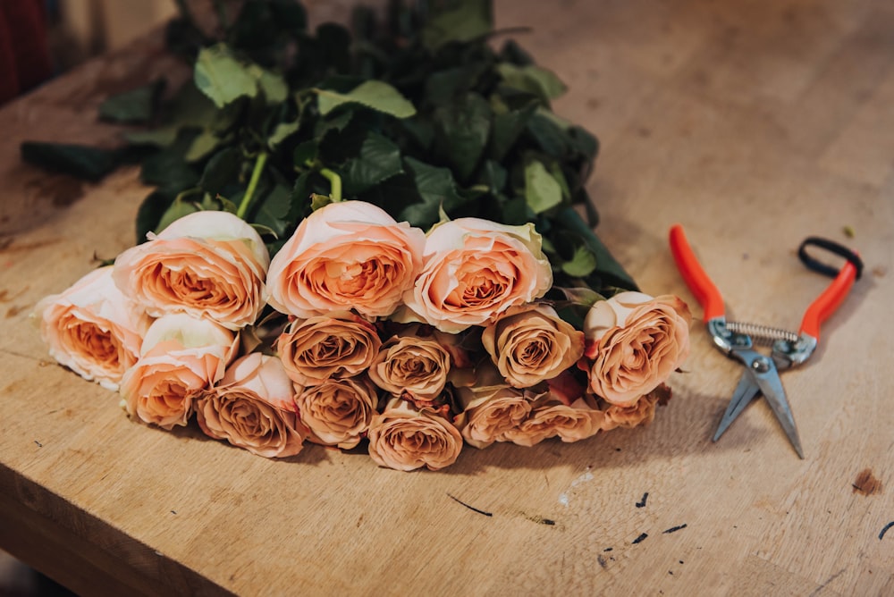 rose arrangement near scissor