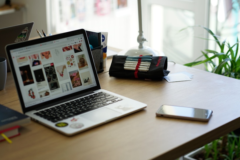 A vibrant workspace with a laptop and creative tools.