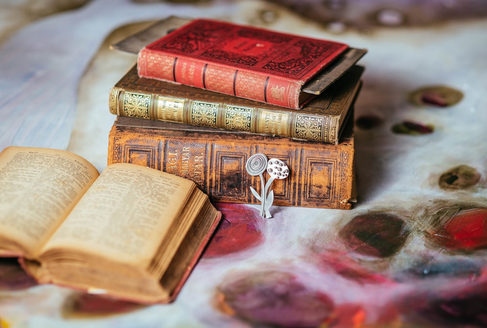 four books on table