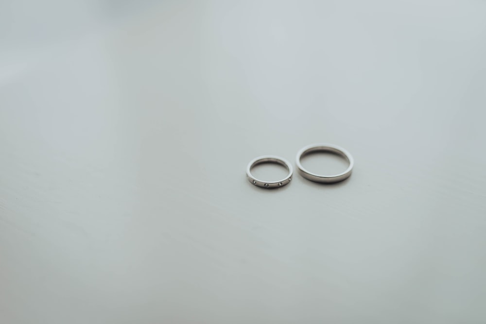 round silver-colored rings