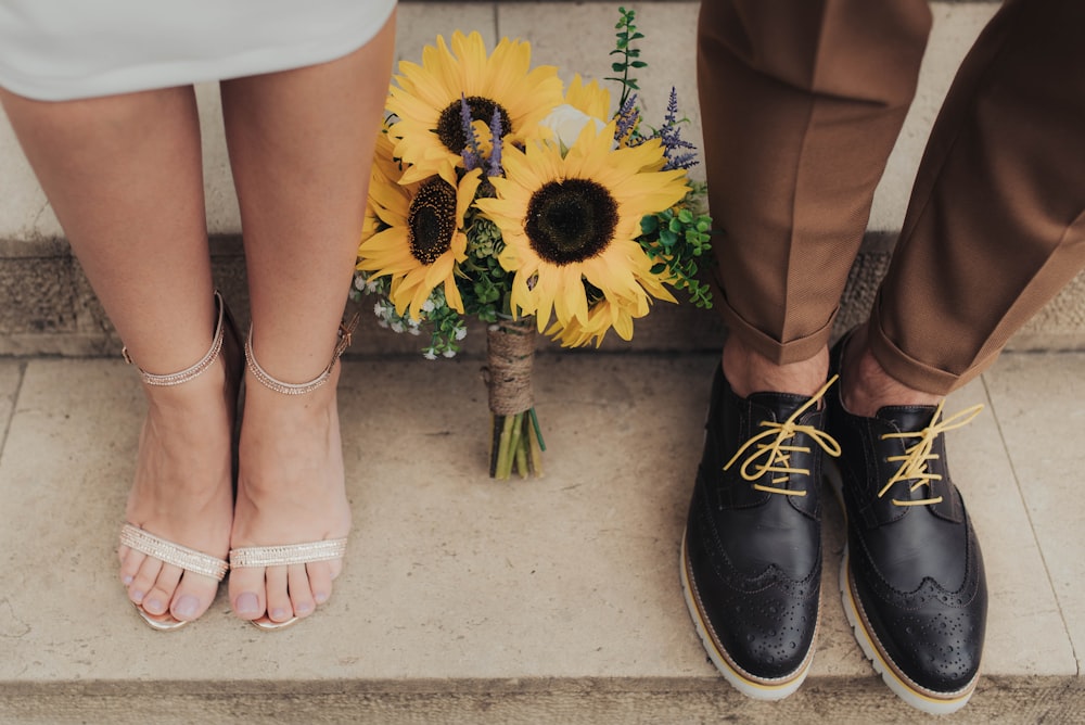 sunflowers between man and woman on staircase