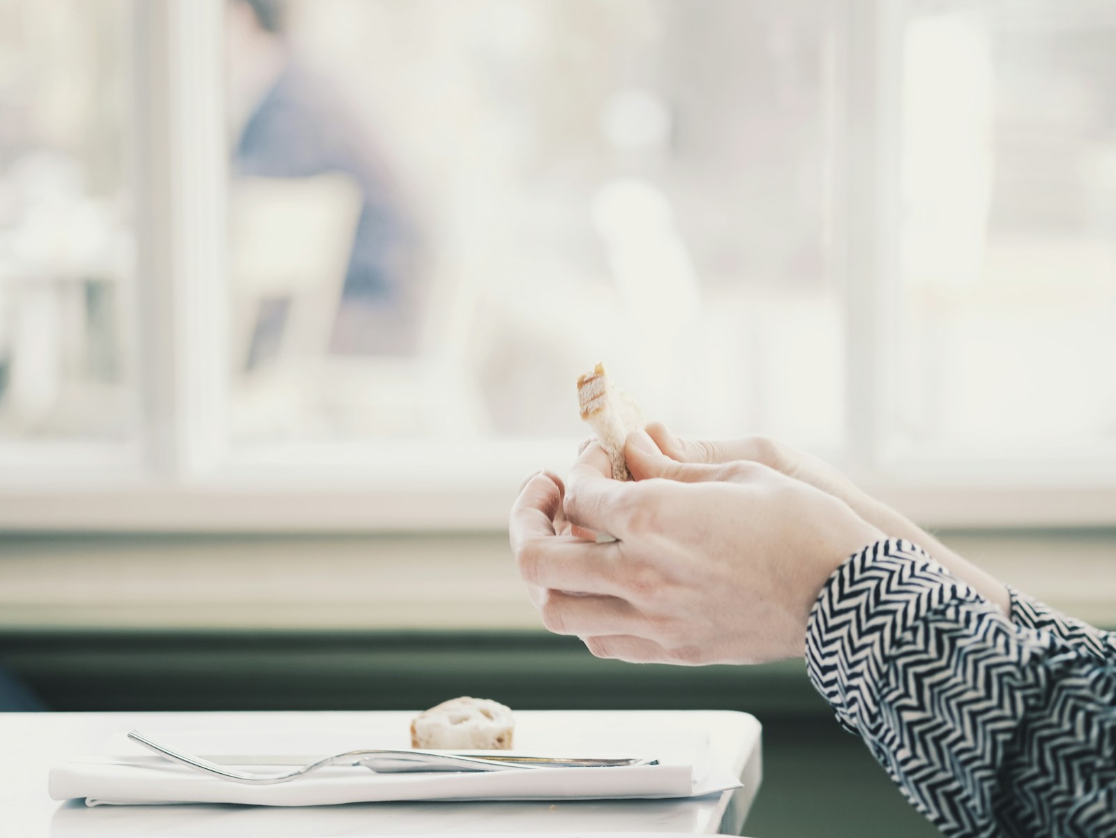 Fujifilm XF 60mm F2.4 R Macro sample photo. Person holding food photography