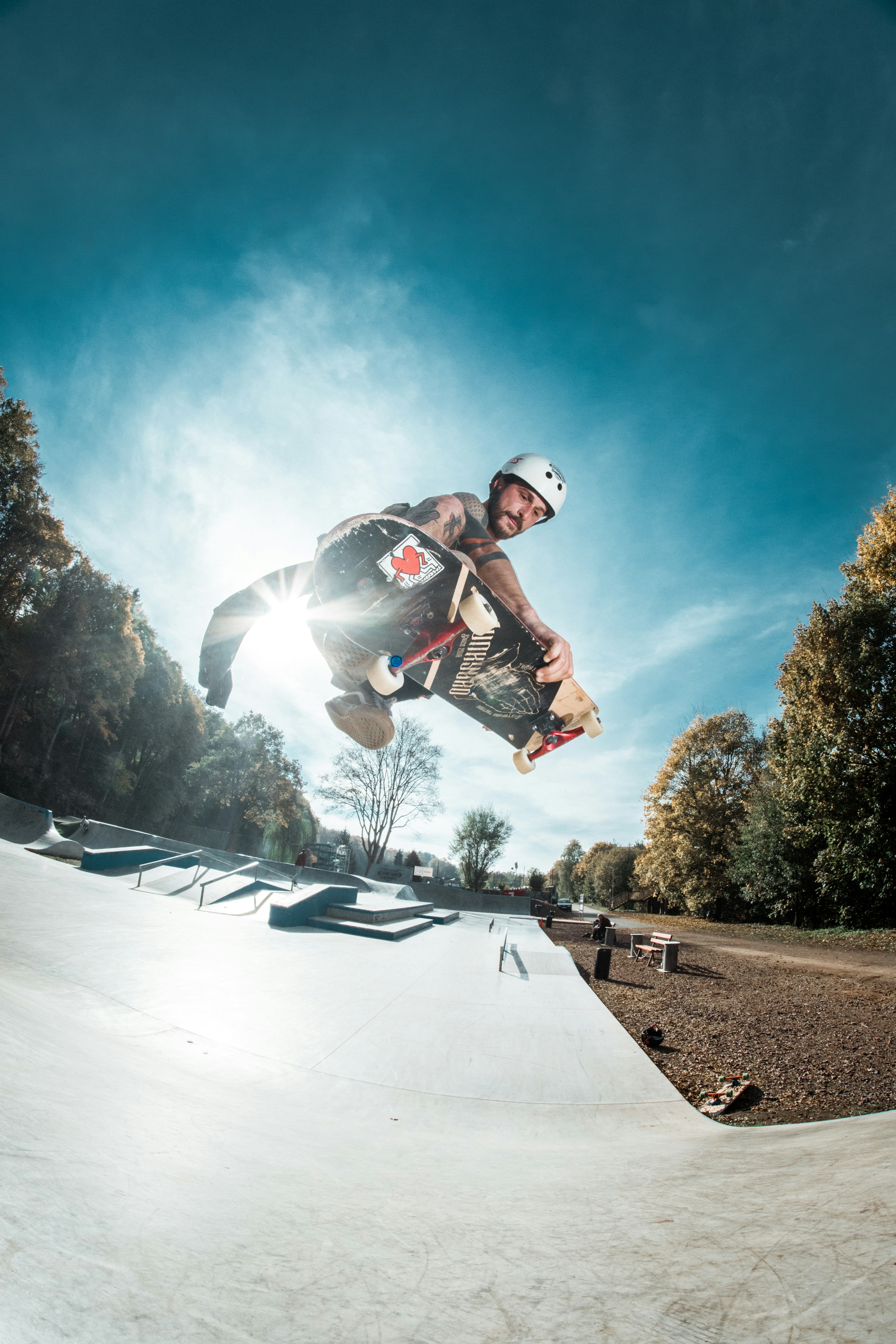 low-angle photography of man riding on skateboard