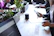 A group of coworkers enjoying lunch with Naturecraft plates at a bright office kitchen.
