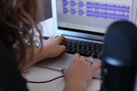 woman using MacBook Air in room