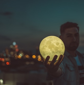 man holding moon lamp