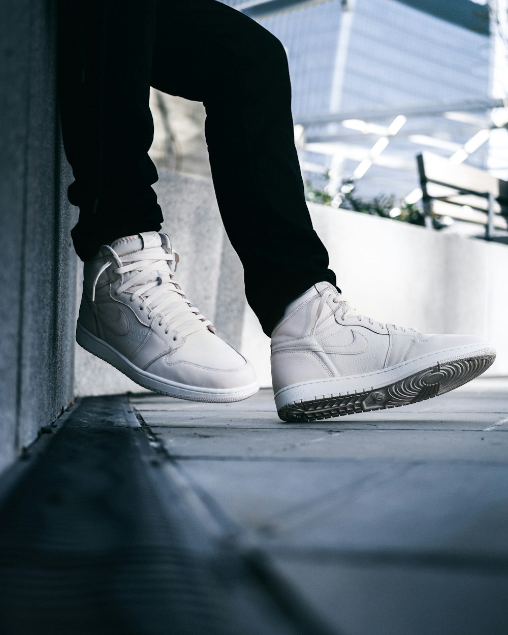 Person wearing white nike mid-rise lace-up sneakers photo – Free London  Image on Unsplash