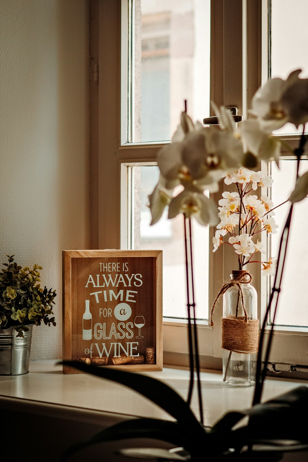 There is always time for a glass of wine frame near window