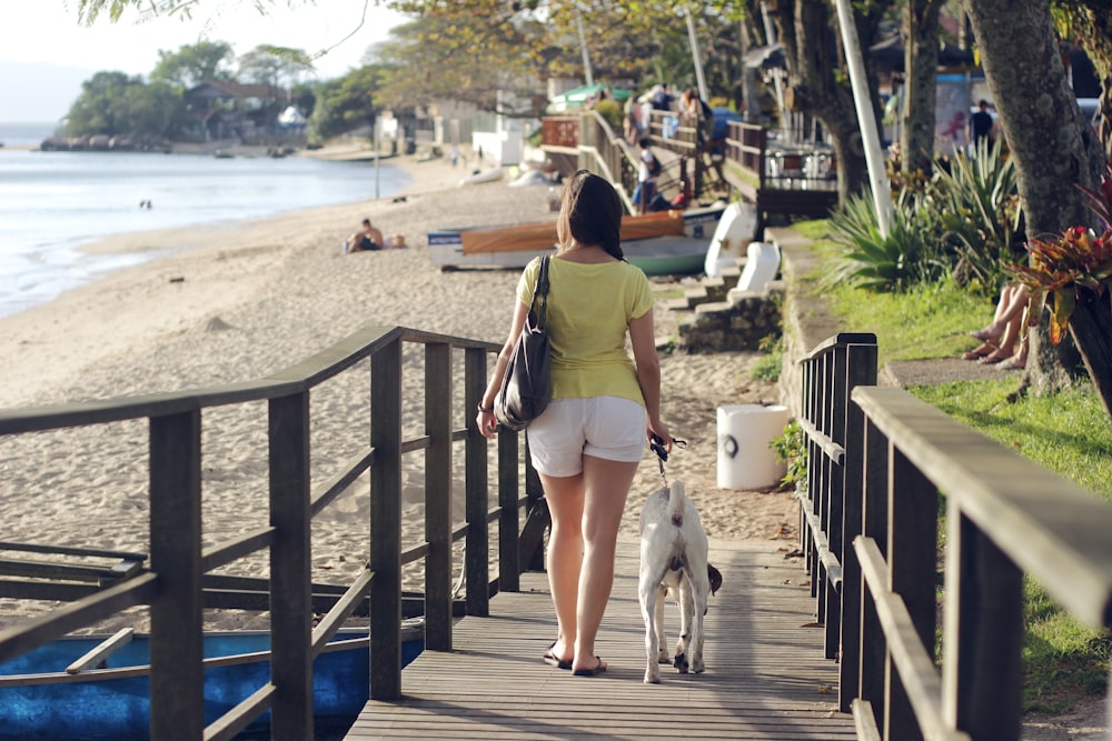 woman walking along side dog