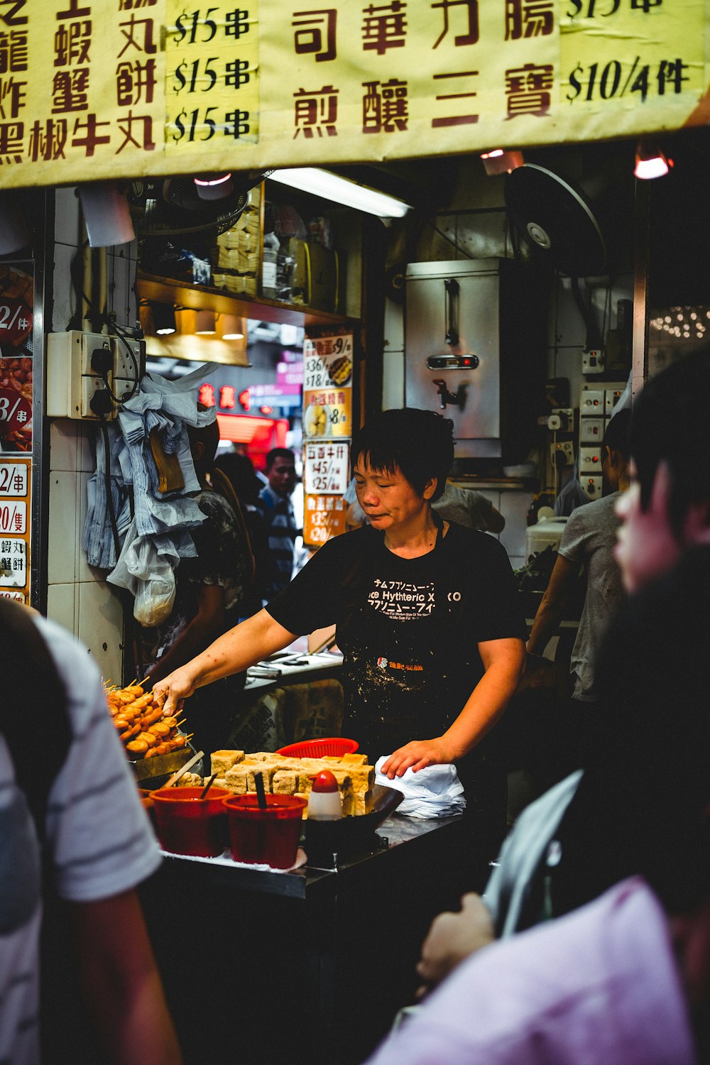 woman cooking in street market place