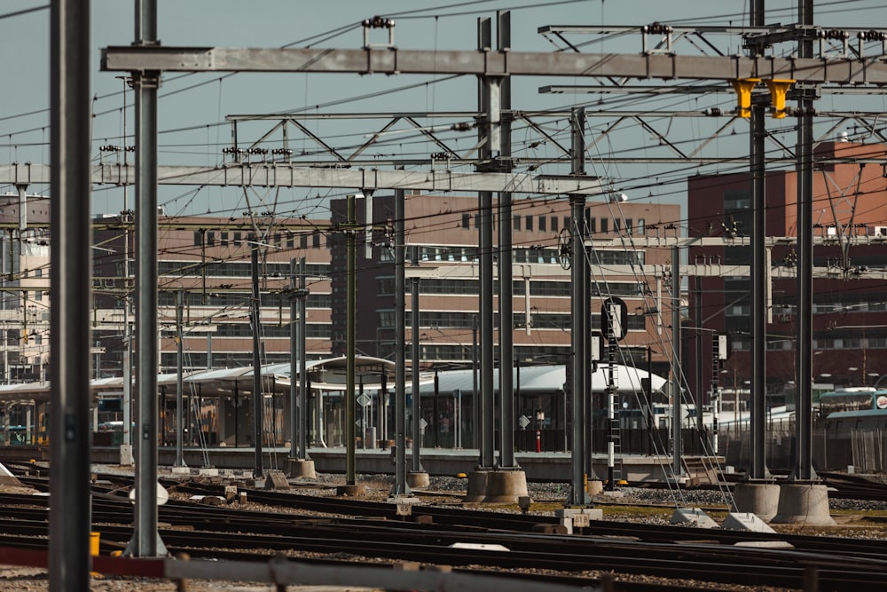 a train on a train track with buildings in the background