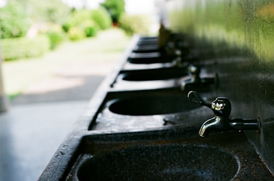 Rows of PTMT water taps neatly arranged in the Ridhi Sidhi Industries manufacturing facility.
