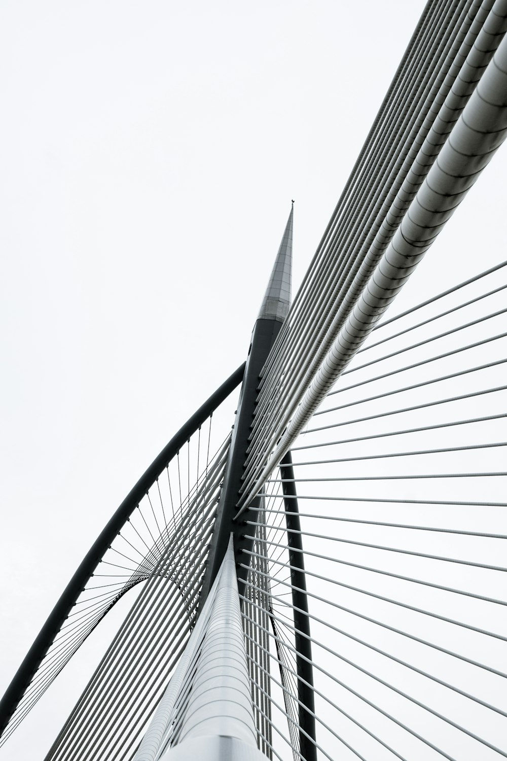 a view of the top of a bridge from below