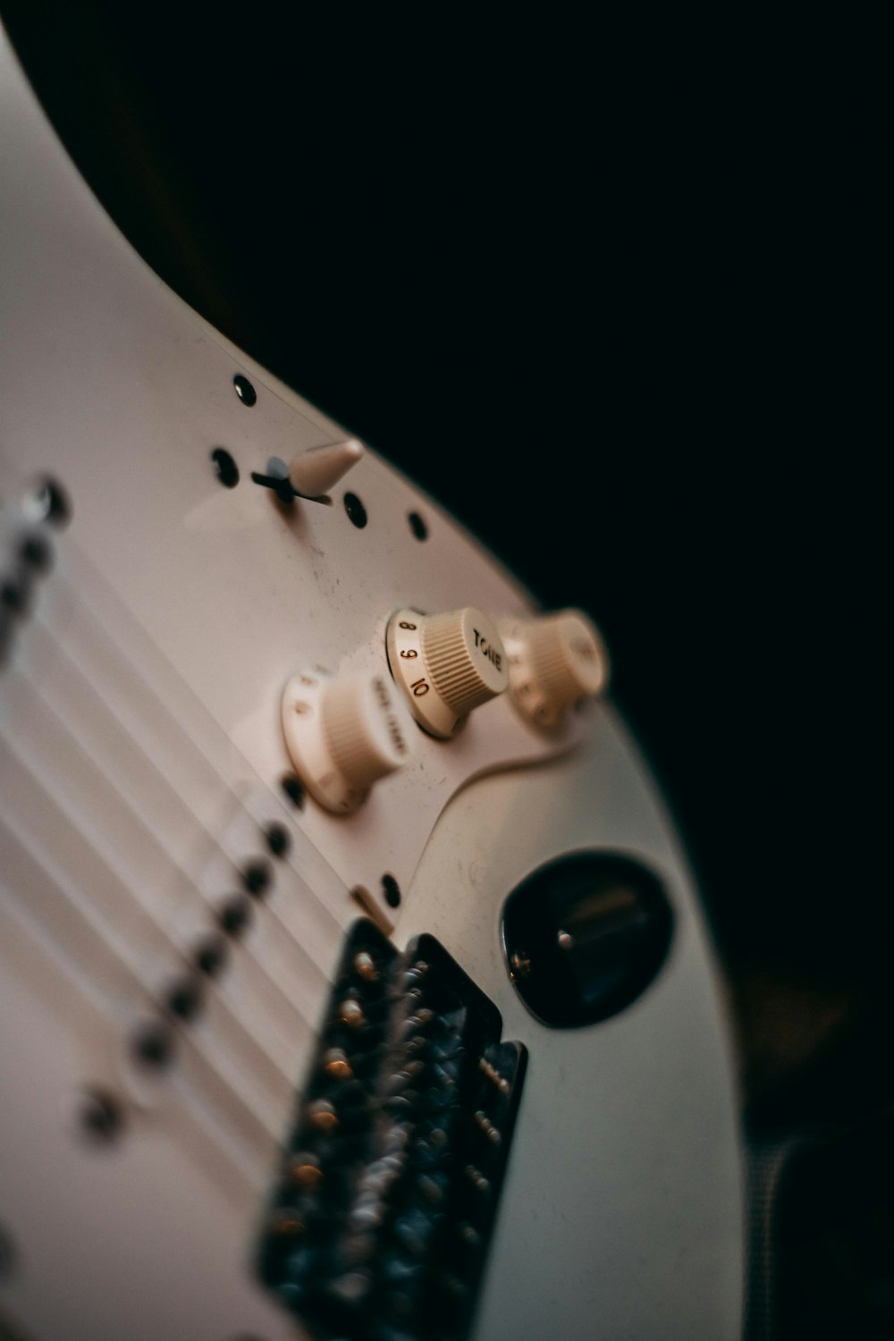 white and black electric guitar