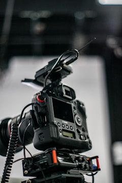Close-up of a durable camera USB cable connected to a professional camera setup.