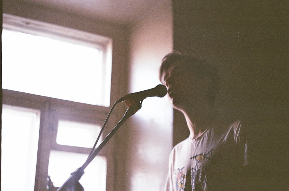 person talking in front of microphone