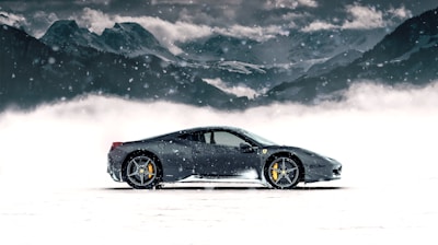 gray coupe on snow