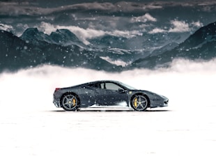 gray coupe on snow