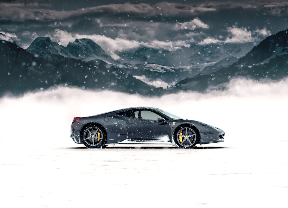 gray coupe on snow