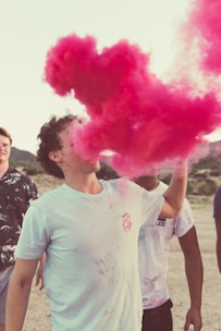 A group of diverse individuals celebrating their smoke-free lifestyles outdoors.
