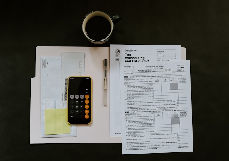 Close-up of invoices and a calculator