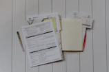 stack of papers flat lay photography