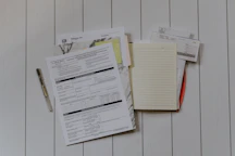 stack of papers flat lay photography