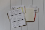 stack of papers flat lay photography