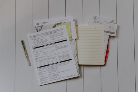 stack of papers flat lay photography