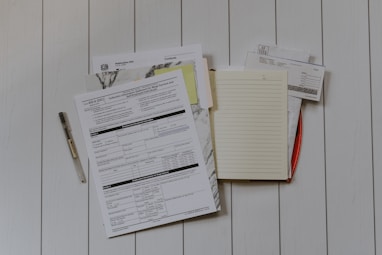 stack of papers flat lay photography