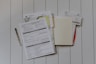 stack of papers flat lay photography