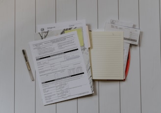 stack of papers flat lay photography