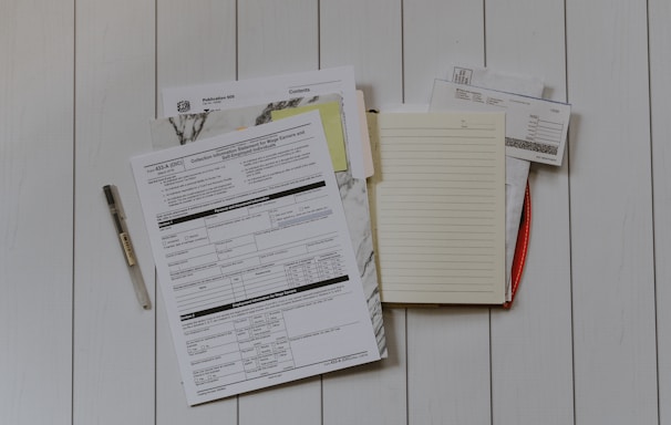 stack of papers flat lay photography