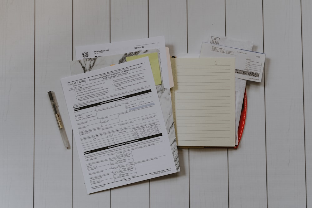 stack of papers flat lay photography