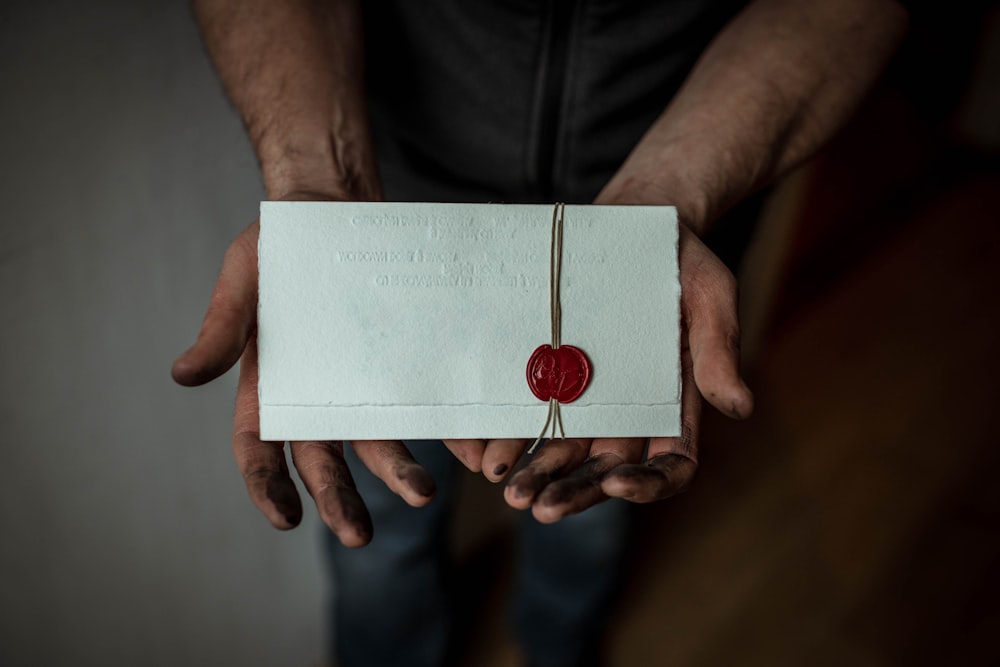 person holding white mail