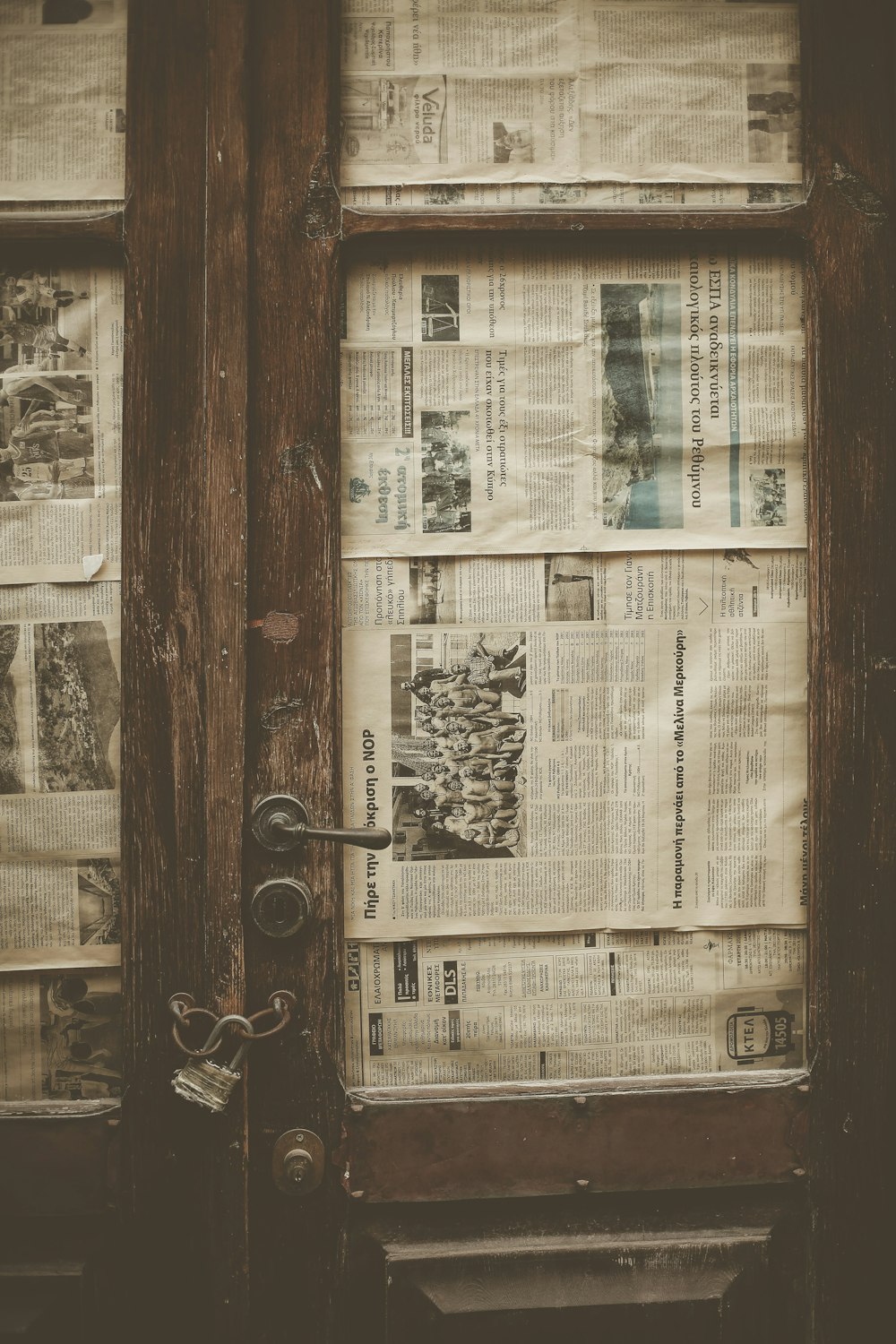 a door that has a bunch of newspapers on it